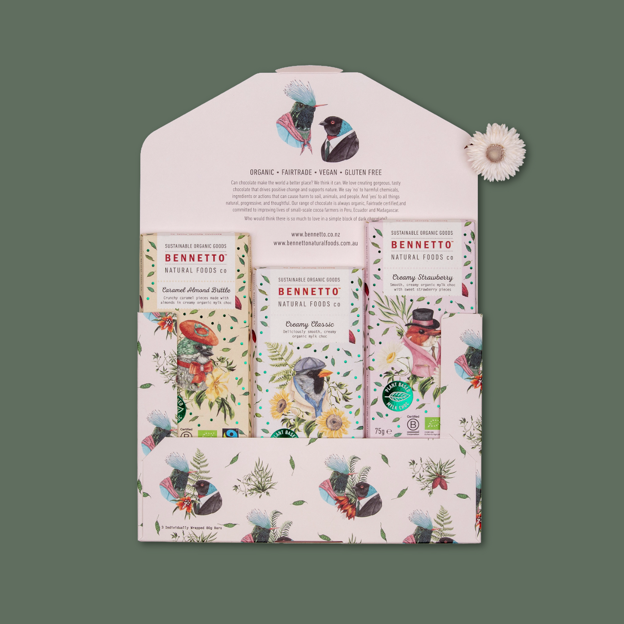 A Bennetto-themed envelope featuring three Bennetto creamy mylk chocolate bars, arranged on a muted green background.