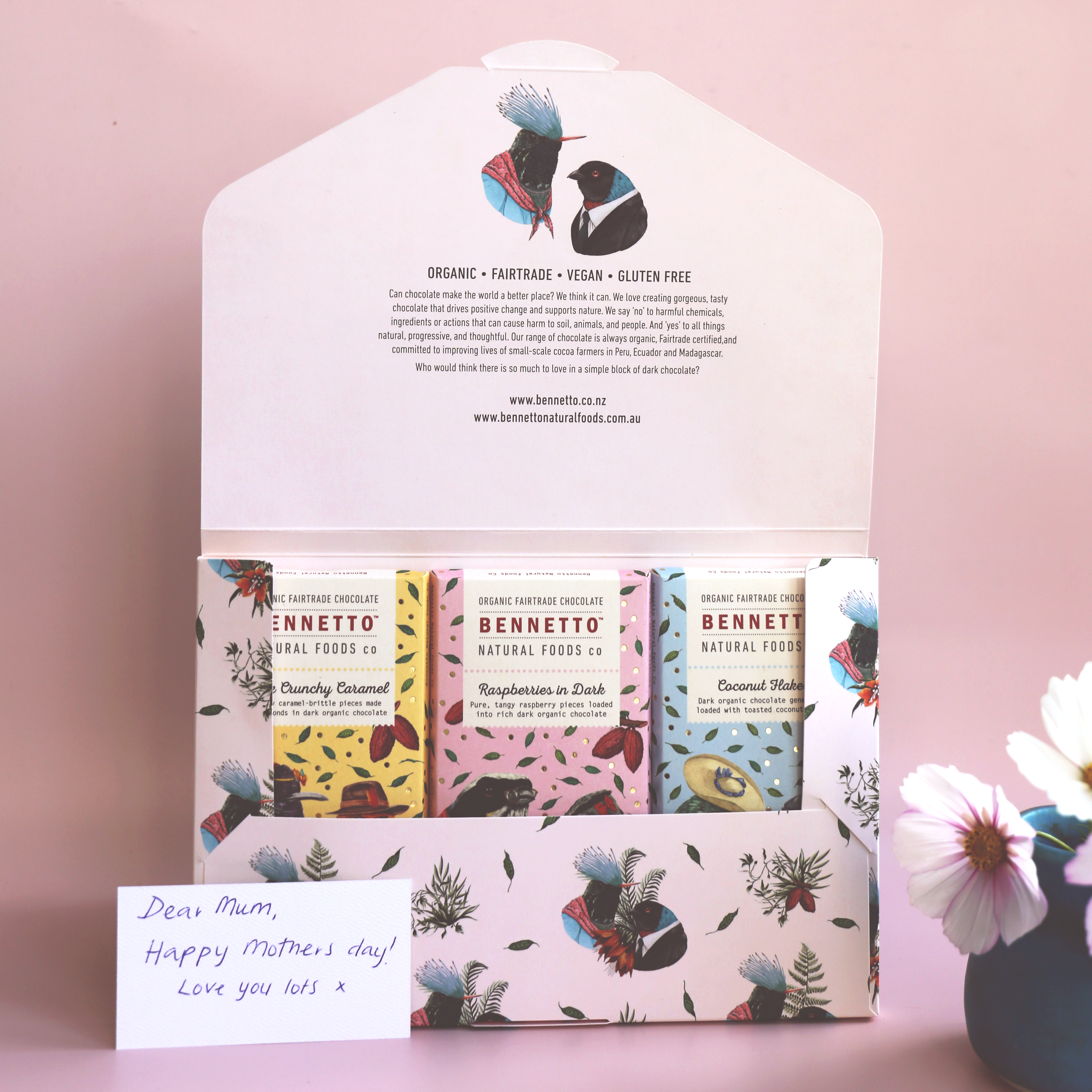 Bennetto chocolate 3-pack for Mother's Day, with 3 bars in a Bennetto-designed signature envelope against a light pink background and flowers to the side. Includes a mother day message.